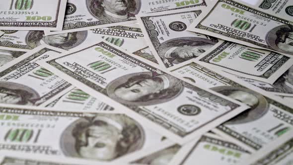 American One Hundred Dollar Paper Banknote Pile on Office Desk alt