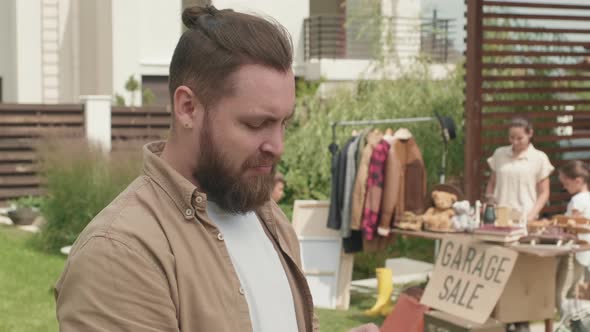 Cheerful Man with Photo Camera Posing alt
