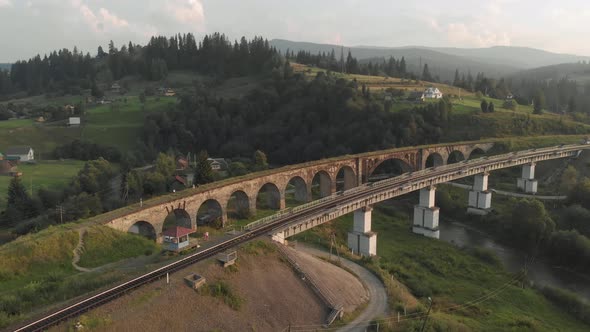 Picturesque Landscape of Ancient Railway Bridge and Village of Vorokhta alt