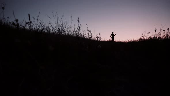 Runner In Sportswear Preparing Triathlon And Workout At Evening. Running Man Silhouette Workout. alt