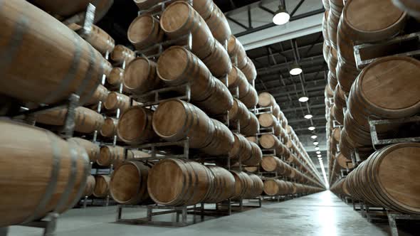Alcohol storage. Old whiskey or wine barrels stacked in rows at the warehouse. alt