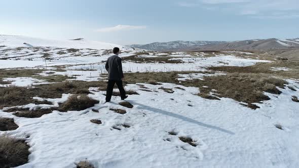 Young Man Walking Snow alt