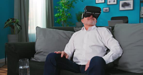 Happy Senior Grandfather in Virtual Headset Glasses Watching Amazing 3d Video in 360 Vr Helmet alt