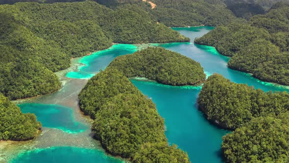 Landscape of Tropical Mountains and Azure Water in Paradise Lagoon. Сoast on the Siargao Island alt