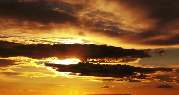 WS T/L Shot of dramatic clouds moving in sky at sunset