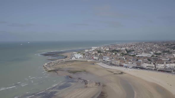 Pull out reveal, Margate beach in Kent England. Smooth aerial drone footage alt