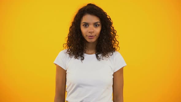 Relaxed Mixed-Race Woman Breathing Deeply and Doing Yoga Exercise, Harmony alt