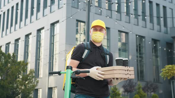 Portrait Shot of Handsome Caucasian Delivery Man in Gloves and Medical Mask alt