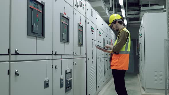 Electrical and Instrument technician checking electrical control board