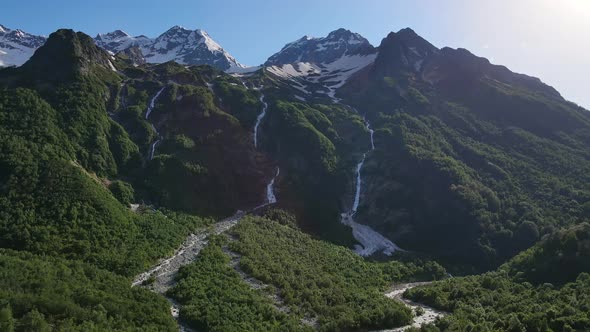 Taimazi Waterfalls Flowing Down From the Slope of Taimazi Mountain alt