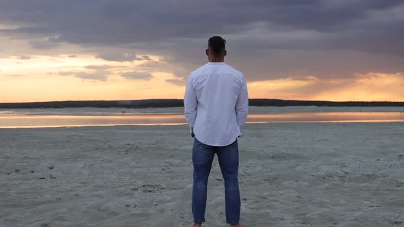 Brutal Man Walking on Beach