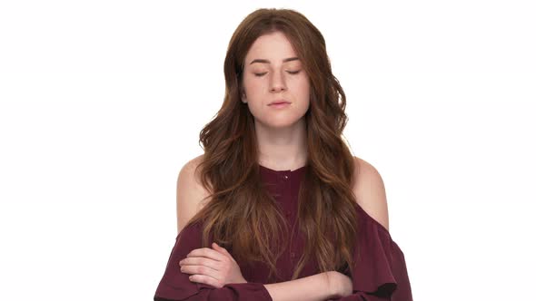 Portrait of Strict Female in Casual Standing with Arms Crossed and Nodding Meaning Approval Isolated alt