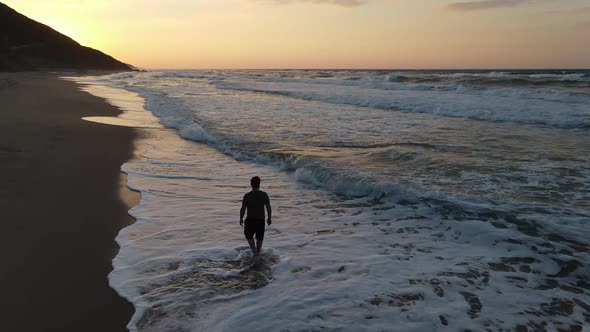 Walking Beach Sunset Aerial Drone alt