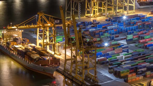 Seaport and Loading Docks at the Port with Cranes and Multicolored Cargo Containers Night Timelapse alt