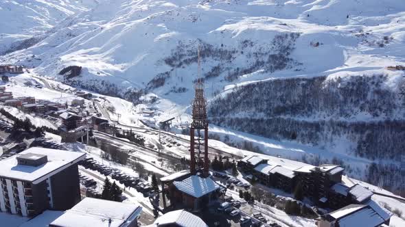 Majestic Winter Aerial Landscape and Ski Resort with Typical Alpine Wooden Houses in French Alps