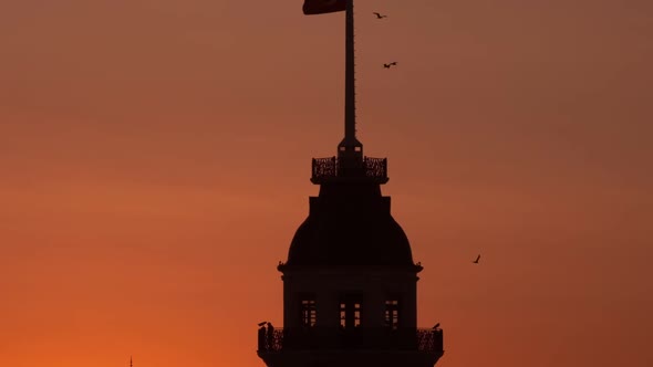 Close Up Silhouettes of The Maidens Tower and Galata Tower In Yellow Sunset alt