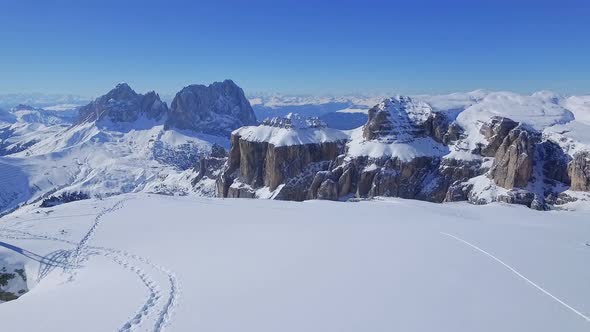 Flight towards the peak of Sasso Pordoi, Dolomites, Italy alt