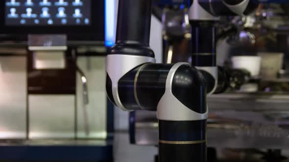 Closeup Motion of Robitic Arm Making Coffee alt