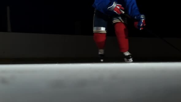 Close Up Slow Motion Hockey Puck And Flying Snow Hockey Player Picks Up The Puck Stick By Petrunine