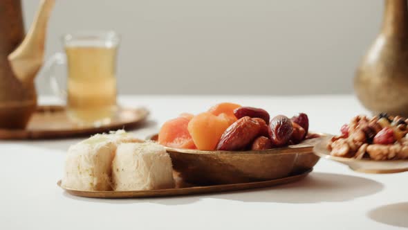 Turkish Tea and Sweets Hot Drink in Traditional Armudu Glass Closeup alt