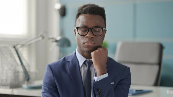 Portrait of Sleepy African Man Taking Nap alt