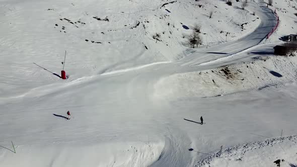 Aerial View of the Alps Mountains in France. Mountain Tops Covered in Snow. Alpine Ski Facilities