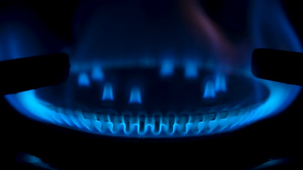 Gas Stove Being Turned on Isolated on Black Background