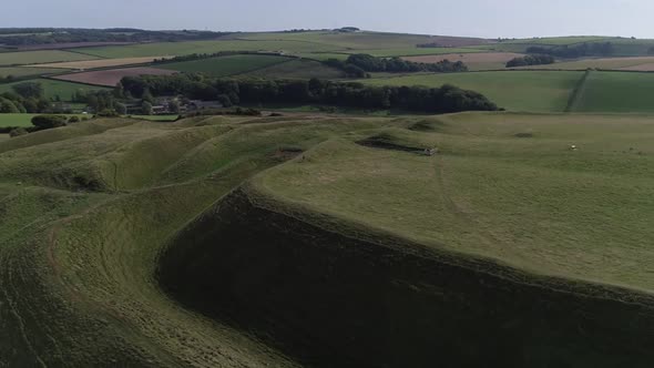Aerial of the eastern gate of the iron age hill fort, Maiden Castle. Fields in the surrounding lands alt