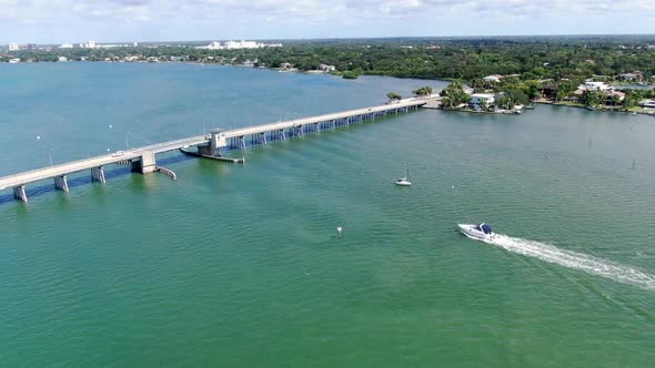 Aerial View of Street Bridge Crossing Ocean alt