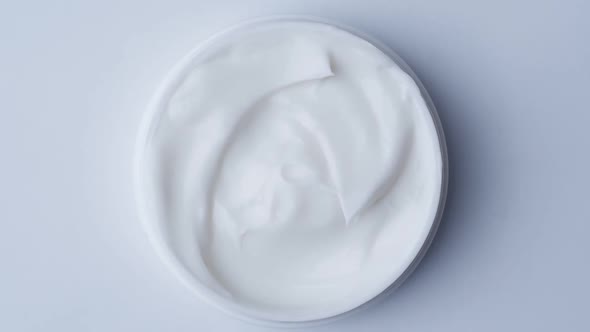 Close Up Shot of Cosmetics Cream with Rotate, Top View alt