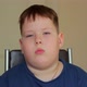 A Fat Sad Boy is Sitting on a Chair - VideoHive Item for Sale