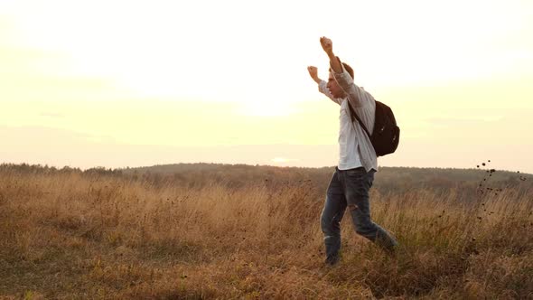 Walk In The Nature Of Dad And Son. Dad And Little Son Greet Each Other Clapping Their Hands. alt