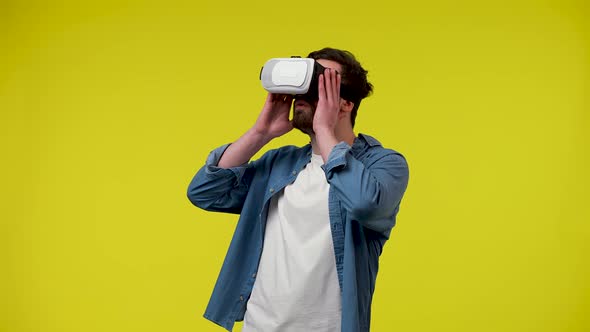 Portrait of a Man with a Virtual Reality Headset or 3d Glasses on His Head alt