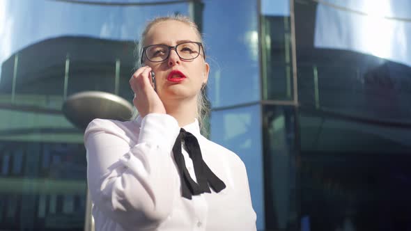 business woman talking on the phone on the business center