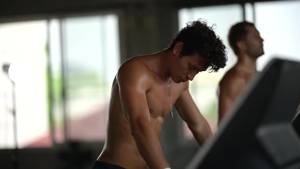 slow-motion shot, sporty people running on treadmill in gym, Good health lifestyle in city alt