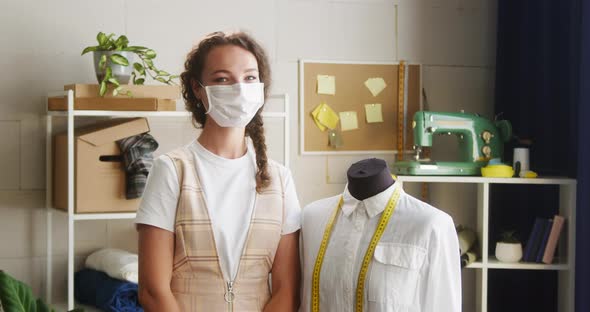 Young Woman Dressmaker Wearing Medical Mask Standing Near Mannequin in Workshop Female Tailor alt