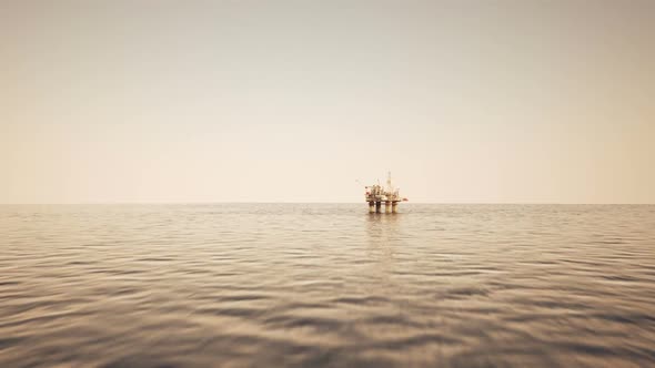 A flight into the oil rig platform area on the sea. Zooming animation. HD alt