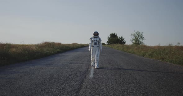 Astronaut Walking on Road alt