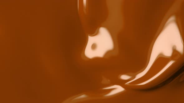 Super Slow Motion Shot of Swirling Brown Fluid Background at 1000Fps alt