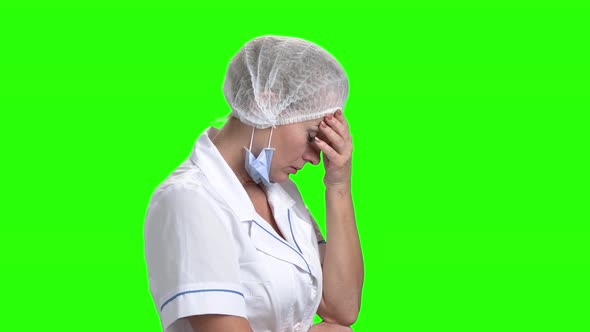 Upset Doctor on Green Screen, Side View. alt