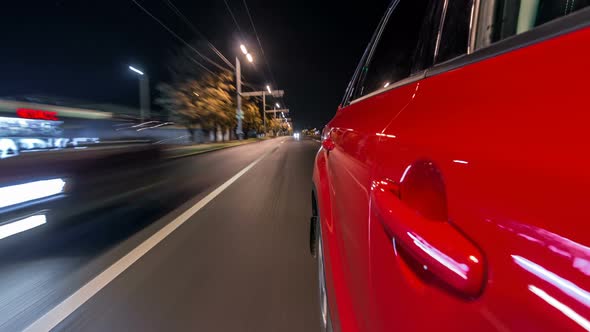 Drivelapse From Side of Car Moving on a Night Avenue in City Timelapse Hyperlapse alt