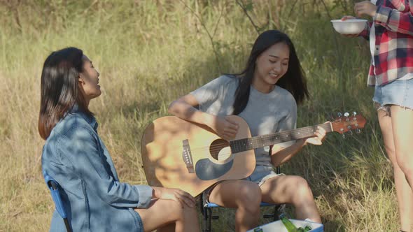 Group of young teen Asian women happy with friends camping in nature.