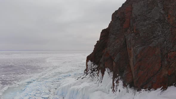 Aerial View of Winter Landscape of Rocky Mountains on Lake Baikal alt