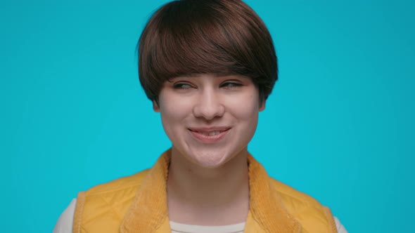 Attractive Woman with Toothy Smile Posing in Studio alt