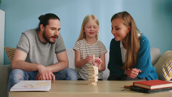 Friendly Family Has Fun Together Playing Board Game