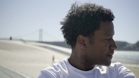 Closeup Shot of Smiling African American Man Training Outdoor alt