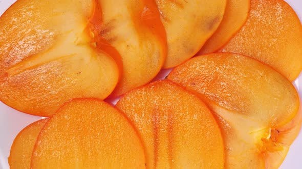 Sliced Fresh Persimmon Closeup Rotates