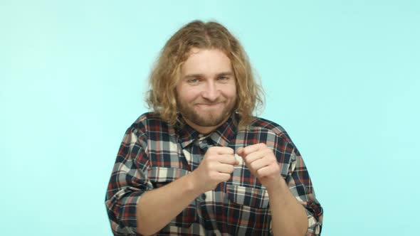Slow Motion of Attractive Adult Man with Blond Wavy Hair and Beard Enjoying Music Having Fun and