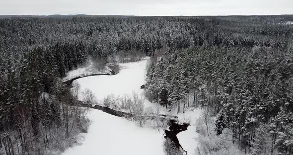 Flying Over Valley with Flowy Twisting River Inside alt
