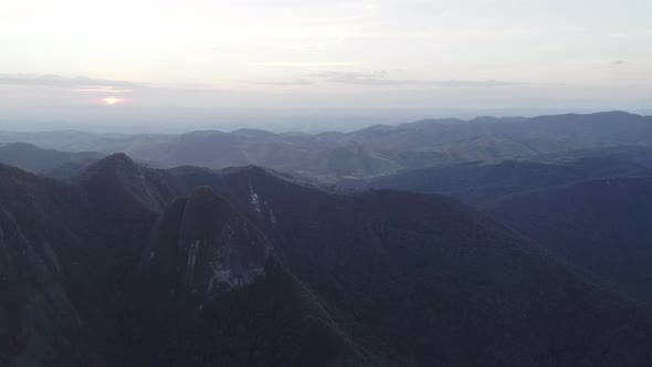 Aerial of sunset over mountain range of Atlantic Forest, Brazil alt